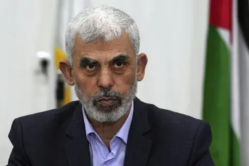 Yahya Sinwar chairs a meeting with leaders of Palestinian factions at his office in Gaza City, April 13, 2022. (AP Photo/Adel Hana, File)