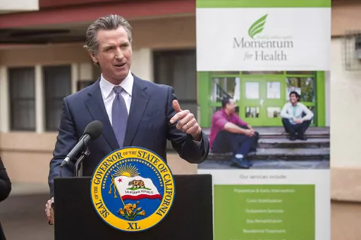 Gov. Gavin Newsom, speaking at a mental health treatment center in San Jose, Calif., announces "Care Court," a program that would target people suffering from psychosis who have lost their ability to care for themselves, Thursday, March 3, 2022. California's governor is proposing a plan to offer more services to homeless people with severe mental health and addiction disorders even if that means forcing some into care. (Karl Mondon/Bay Area News Group via AP)