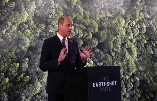 Britain's Prince William speaks during a meeting with Earthshot prize winners and finalists at the Glasgow Science Center on the sidelines of the COP26 U.N. Climate Summit in Glasgow, Scotland, Nov. 2, 2021. The conservation charity founded by the prince, who launched the Earthshot Prize, keeps its investments in a bank that is one of the world’s biggest backers of fossil fuels. (AP Photo/Alastair Grant, Pool, File)