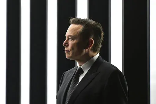 Elon Musk, Tesla CEO, attends the opening of the Tesla factory Berlin Brandenburg in Gruenheide, Germany, March 22, 2022. The intrigue surrounding Musk's Twitter investment took a new twist Tuesday, April 12, 2022, with the filing of a lawsuit alleging the colorful billionaire illegally delayed disclosing his big stake in the social media company so he could buy more shares at lower prices. (Patrick Pleul/Pool Photo via AP, File)