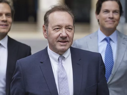 US Actor Kevin Spacey, center, arrives at Southwark Crown Court, London, Tuesday, July 4, 2023. Spacey is charged with three counts of indecent assault, seven counts of sexual assault, one count of causing a person to engage in sexual activity without consent and one count of causing a person to engage in penetrative sexual activity without consent between 2001 and 2005. (Lucy North/PA via AP)