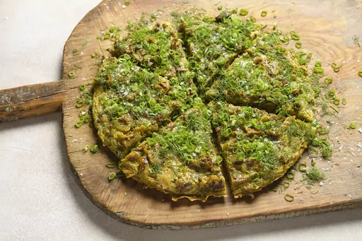 This image released by Milk Street shows a recipe for spiced beef and potato eggah. (Milk Street via AP)