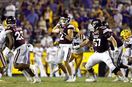 Mississippi State quarterback Will Rogers (2) looks to pass in front of LSU defensive end BJ Ojulari (18) during the second half of an NCAA college football game in Baton Rouge, La., Saturday, Sept. 17, 2022. LSU won 31-16. (AP Photo/Tyler Kaufman)