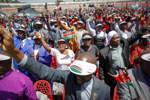 Kenyans attend a national day of prayer event held at Nyayo stadium in the capital Nairobi, Kenya, Tuesday, Feb. 14, 2023. With the prospect of a sixth consecutive failed rainy season in the east and Horn of Africa, Kenya's president is hoping the heavens will finally open with the help of a national day of mass prayer. (AP Photo/Brian Inganga)