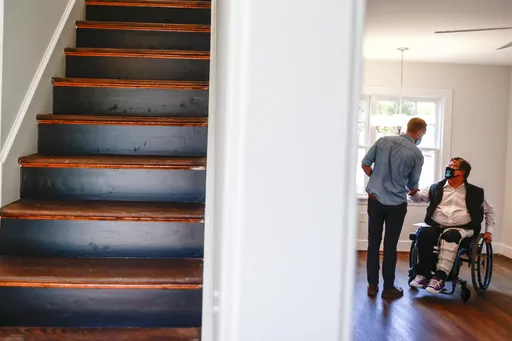 BoundaryLess Living founder and CEO William Sweeney, chats with an attendee on Nov. 17, 2021 at a BoundaryLess Living adaptive living home in Richmond, Va. Roughly 1.8 million businesses in the U.S. are owned by someone with a disability, according to the American Community Survey conducted by the U.S. Census Bureau. And while the path to entrepreneurship is rarely easy, business owners with disabilities often need to overcome additional challenges, like societal misconceptions, barriers to fina