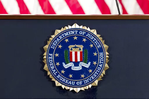 The FBI seal is displayed on a podium before a news conference at the agency's headquarters on June 14, 2018, in Washington. A U.S. senator is pressing the FBI for more information after a whistleblower alleged that an internal review found 665 FBI personnel have resigned or retired to avoid accountability in misconduct probes over the past two decades, according to a letter early from the senator early Oct. 2022. (AP Photo/Jose Luis Magana, File)