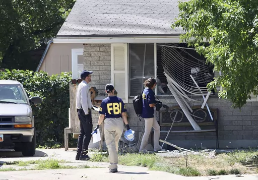 Law enforcement investigate the scene of a shooting involving the FBI, Aug. 9, 2023 in Provo, Utah. This week's confrontation that ended with FBI agents fatally shooting a 74-year-old Utah man who threatened to assassinate President Joe Biden was just the latest example of how violent rhetoric has created a more perilous political environment across the U.S. (Laura Seitz/The Deseret News via AP, File)