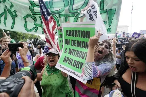 People protest about abortion, Friday, June 24, 2022, outside the Supreme Court in Washington. Two years after a leaked draft of a U.S. Supreme Court opinion singled that the nation's abortion landscape was about to shift dramatically, the issue is still consuming the nation's courts, legislatures and political campaigns and changing the course of lives.(AP Photo/Steve Helber, File)