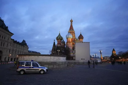 A police car is parked in Red Square, with St. Basil's Cathedral in the background, in Moscow, Russia, March 4, 2022. (AP Photo, File)