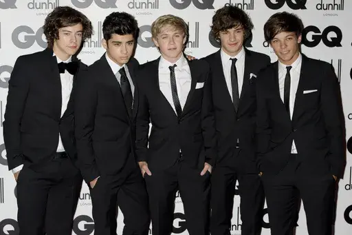 One Direction's Liam Payne, second from right, poses for a photo with fellow band members Harry Styles, Zayn Malik, Niall Horan and Louis Tomlinson at the GQ Men of the Year Awards in London, Sept. 6, 2011. (AP Photo/Jonathan Short, File)