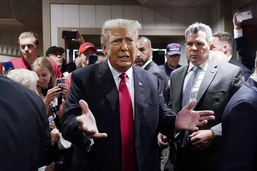 Former President Donald Trump greets supporters before speaking at the Westside Conservative Breakfast, June 1, 2023, in Des Moines, Iowa. As Ron DeSantis embarked on the first official week of his presidential candidacy, the Florida governor repeatedly hit his chief rival, Trump, from the right. (AP Photo/Charlie Neibergall, File)