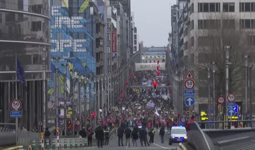 In this grab taken from video, climate activists take part in a march, in Brussels, Sunday, Dec. 3, 2023. Thousands of people have marched through the center of Brussels in a boisterous rally highlighting the dangers of climate change, as the COP28 climate summit draws to an end in the United Arab Emirates. (AP)