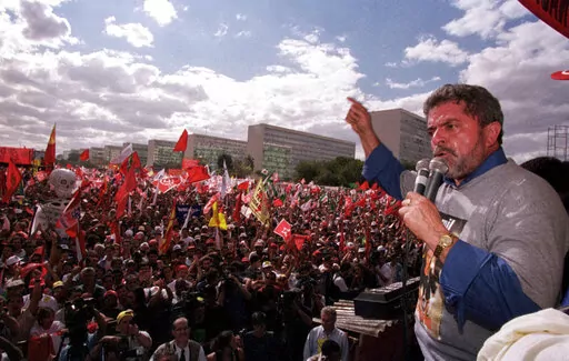 Honorary president of the Workers Party, Luiz Inacio Lula da Silva, speaks during a protest against the free-market reforms of President Fernando Henrique Cardoso, in Brasilia, Brazil, Aug. 26, 1999. (AP Photo/Beto Barata, File)