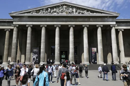 Visitors walk outside the British Museum in Bloomsbury, London, Friday, June 26, 2015. The British Museum is suing a former curator alleged to have stolen almost 2,000 artifacts from its collections and offered them for sale online. Peter Higgs was fired in July 2023 after more than 1,800 items were discovered to be missing. (AP Photo/Tim Ireland, File)