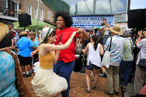 The dance floor is full as Tuba Skinny performs at the French Market Traditional Jazz Stage during the French Quarter Festival on Sunday April 13, 2014. It's been two years since the largest free festival and showcase of Louisiana music, food and culture has taken place in New Orleans' French Quarter. But that changes in April, when the 2022 French Quarter Festival returns. The coronavirus pandemic forced organizers to cancel the event in 2020 and last year. (Kathleen Flynn/The Times-Picayune/Th