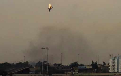 A war plane is shot down over the outskirts of Benghazi, eastern Libya, Saturday, March 19, 2011. On Friday, Feb. 25, 2022, The Associated Press reported that footage of the plane crashing in Libya in 2011 circulated online with false claims that it was captured during Russia's 2022 invasion of Ukraine. (AP Photo/Anja Niedringhaus)