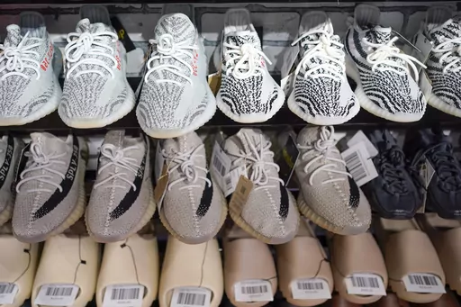 Yeezy shoes made by Adidas are displayed at Laced Up, a sneaker resale store, in Paramus, N.J., on Oct. 25, 2022. Adidas is releasing a second batch of high-end Yeezy sneakers after cutting ties with rapper Ye, formerly known as Kanye West, as the shoemaker seeks to unload the unsold shoes while donating to groups fighting antisemitism. The online sale, to start Wednesday Aug. 2, 2023 through the Confirmed app, Adidas app and adidas.com, follows an earlier batch of sales in May. (AP Photo/Seth W