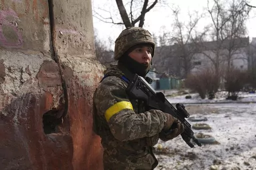 A Ukrainian serviceman guards his position in Mariupol, Ukraine, Saturday, March 12, 2022. Ukraine’s military says Russian forces have captured the eastern outskirts of the besieged city of Mariupol. In a Facebook update Saturday, the military said the capture of Mariupol and Severodonetsk in the east were a priority for Russian forces. Mariupol has been under siege for over a week, with no electricity, gas or water. (AP Photo/Evgeniy Maloletka)
