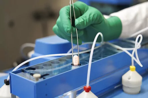 This image provided by Pfizer shows the company's COVID-19 Paxlovid pills. Pfizer's and Merck's COVID-19 pills that were supposed to be an important weapon against the pandemic in the U.S. are in short supply and have played little role in the fight against the omicron wave of infections. (Pfizer via AP, File)