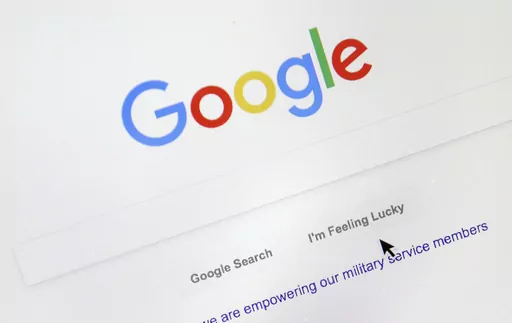 A cursor moves over Google's search engine page, Aug. 28, 2018, in Portland, Ore. Good news for all the password-haters out there: Google has taken a big step toward making them an afterthought by adding “passkeys” as a more straightforward and secure way to log into its services. (AP Photo/Don Ryan, File)