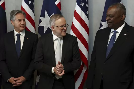 Australian Prime Minister Anthony Albanese, center, speaks with U.S. Secretary of State Antony Blinken, left, and U.S. Defense Secretary Lloyd Austin prior to a lunch in Brisbane, Australia Friday, July 28, 2023. (Pat Hoelscher/Pool Photo via AP)