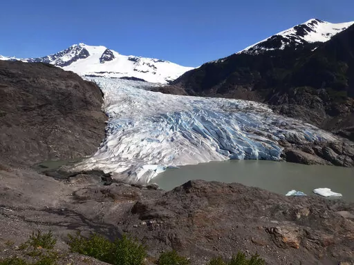 Chunks of ice float on Mendenhall Lake in front of the Mendenhall Glacier on Monday, May 30, 2022, in Juneau, Alaska. A study of all of the world's 215,000 glaciers published on Thursday, Jan. 5, 2023, finds even if with the unlikely minimum warming of only a few tenths of a degrees more, the world will lose nearly half its glaciers by the end of the century. With the warming we're now on track to get, the world will lose two-thirds of its glaciers and overall glacier mass will drop by one-third