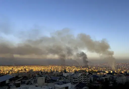 Smoke rises from Israeli airstrikes in the southern suburbs of Beirut, Lebanon, Saturday, Sept. 28, 2024. (AP Photo/Hussein Malla)