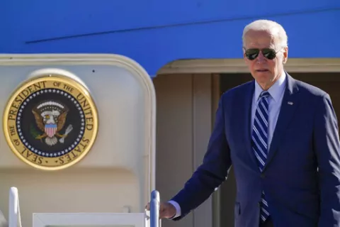 President Joe Biden pauses at the top of the stairs as he boards Air Force One at Andrews Air Force Base, Md., Thursday, Oct. 20, 2022, en route to Pennsylvania. (AP Photo/Carolyn Kaster)
