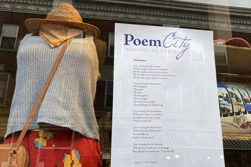 A poem is adhered to a storefront window Saturday, April 1, 2023, in Montpelier, Vt. The city, the smallest capital city in the country, goes all out during National Poetry Month each April, with hundreds of poems by Vermonters in storefront windows, readings, workshops. (AP Photo/Lisa Rathke)