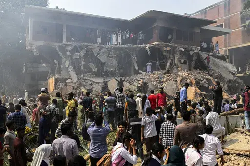 People stand around the vandalized residence of Sheikh Mujibur Rahman, Bangladesh's former leader and the father of the country's ousted Prime Minister Sheikh Hasina, in Dhaka, Bangladesh, Thursday, Feb. 6, 2025. (AP Photo/Mahmud Hossain Opu)