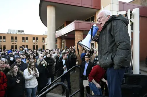 Sen. Bernie Sanders, I-Vt., right, speaks to an overflow crowd outside Lincoln High School as he talks about "Fighting Oligarchy: Where We Go From Here", Saturday, March 8, 2025, in Warren, Mich. (AP Photo/Jose Juarez)