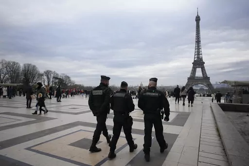 French gendarmes patrol the Trocadero plaza near the Eiffel Tower after a man targeted passersbys late saturday, killing a German tourist with a knife and injuring two others in Paris, Sunday, Dec. 3, 2023. Police subdued the man, a 25-year-old French citizen who had spent four years in prison for a violent offense. After his arrest, he expressed anguish about Muslims dying, notably in the Palestinian territories. (AP Photo/Christophe Ena)