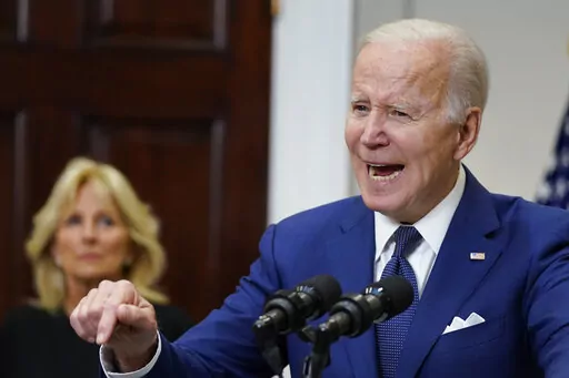 President Joe Biden speaks about the mass shooting at Robb Elementary School in Uvalde, Texas, from the White House, in Washington, Tuesday, May 24, 2022, as first lady Jill Biden listens. (AP Photo/Manuel Balce Ceneta)