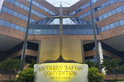 A cross and Bible sculpture stand outside the Southern Baptist Convention headquarters in Nashville, Tenn., May 24, 2022. On Tuesday, Sept. 20, 2022, the Southern Baptists' top administrative body voted to cut ties with two congregations: an LGBTQ-friendly church in North Carolina that had itself quit the denomination decades earlier and a New Jersey congregation it cited for “alleged discriminatory behavior.” (AP Photo/Holly Meyer, File)