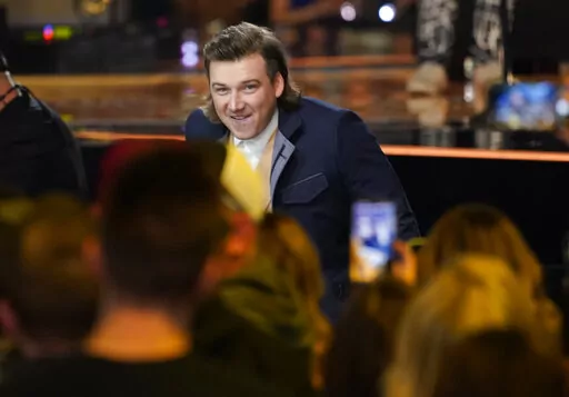 Morgan Wallen accepts the award for album of the year for "Dangerous: The Double Album" at the 57th Academy of Country Music Awards on Monday, March 7, 2022, at Allegiant Stadium in Las Vegas. (AP Photo/John Locher)