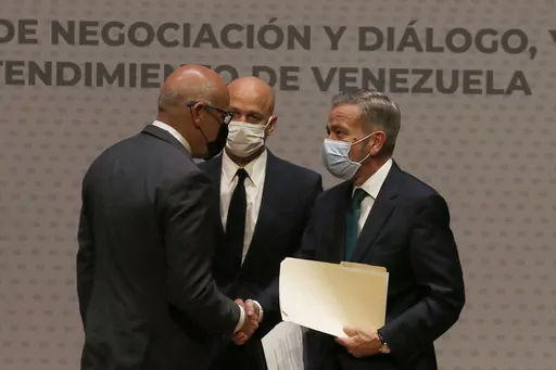 Venezuelan President of the National Assembly Jorge Rodriguez, left, shakes hands with Venezuelan opposition delegate Gerardo Blyde Perez in Mexico City, Aug. 13, 2021. Venezuela’s government and opposition will resume their dialogue, mediated by Norway, with talks scheduled for Tuesday, Oct. 17,2023 in Barbados, Norway’s embassy in Mexico said on Oct. 16, 2023 in a brief statement. (AP Photo/Marco Ugarte, File)