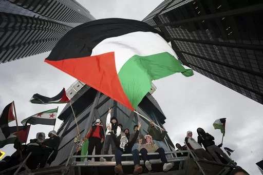 Supporters wave the Palestine flag at a march in Toronto, on Oct. 9, 2023. Before it transformed into X, Twitter was the place to turn to for live and reliable information about big news events, from wars to natural disasters. But as the Israel-Hamas war has underscored, that is no longer the case. (Arlyn McAdorey/The Canadian Press via AP, File)