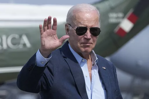 President Joe Biden waves as he walks to board Air Force One at Dover Air Force Base, Del., Monday, June 19, 2023, as he heads to California. Biden is ramping up his reelection effort this week with four fundraisers in the San Francisco area, as his campaign builds up its coffers and lays strategic foundations for 2024. (AP Photo/Susan Walsh)