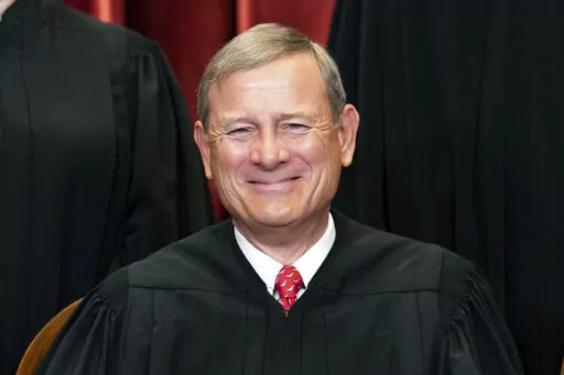 Chief Justice John Roberts sits during a group photo at the Supreme Court in Washington, April 23, 2021. Roberts is set to make his first public appearance since the U.S. Supreme Court overturned Roe v. Wade, speaking Friday night, Sept. 9, 2022, at a judicial conference in Colorado.(Erin Schaff/The New York Times via AP, Pool, File)