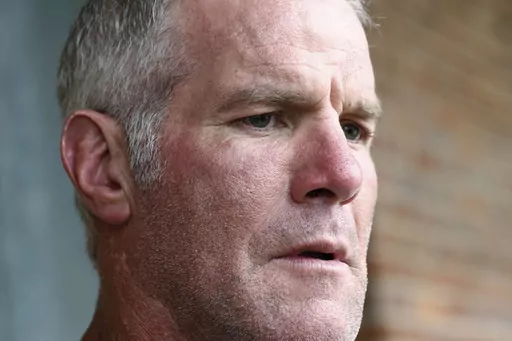 Former NFL quarterback Brett Favre speaks to the media in Jackson, Miss., Oct. 17, 2018. Favre will not be dismissed from a lawsuit that seeks to recover millions of dollars of misspent welfare money that was supposed to help some of the neediest people in the United States, a Mississippi judge ruled Monday, April 24, 2023. (AP Photo/Rogelio V. Solis, File)