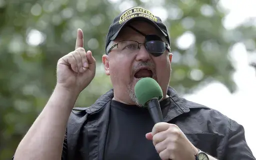 Stewart Rhodes, founder of the Oath Keepers, speaks during a rally outside the White House in Washington, June 25, 2017. (AP Photo/Susan Walsh, File)
