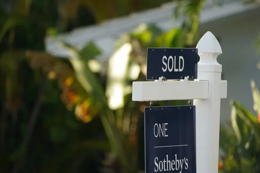 A sold sign is shown in front of a home, Monday, Sept. 20, 2021, in Surfside, Fla.  Average long-term U.S. mortgage rates rose this week as the key 30-year loan vaulted over 4% for the first time since May 2019. Mortgage buyer Freddie Mac reports, Thursday, March 17, 2022,  that the average rate on the 30-year loan this week jumped to 4.16% from 3.85% last week.   (AP Photo/Wilfredo Lee)