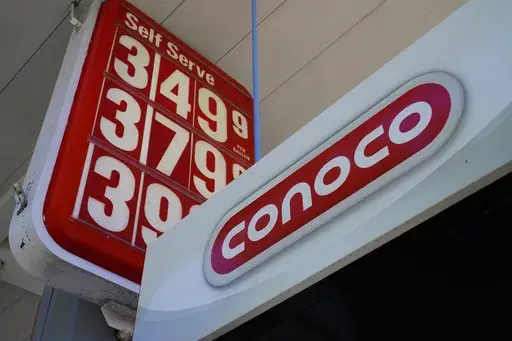 A Conoco gas station sign is shown in Glenside, Pa., Sept. 29, 2021. ConocoPhillips is buying Marathon Oil in an all-stock deal valued at approximately $17.1 billion as energy prices soar and big oil companies reap massive profits.(AP Photo/Matt Rourke, File)