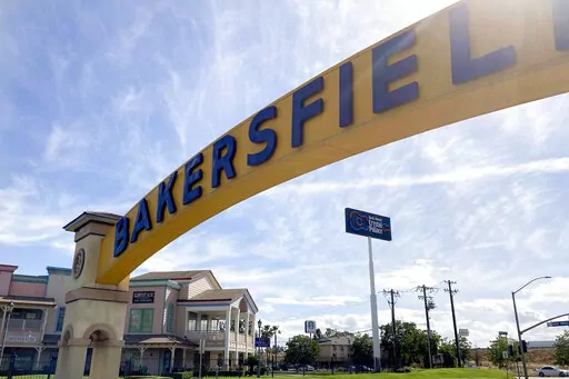 A sign for Bakersfield, Calif., is displayed over Sillect Avenue at Buck Owens Boulevard on April 20, 2022. House Republican leader Kevin McCarthy is a son of California’s Central Valley, a farming and oil-pumping heartland. It's a swath of rural conservatism amid California’s progressive politics and it's Donald Trump's slice of California. It's here that McCarthy launched his political rise. (AP Photo/Lisa Mascaro)