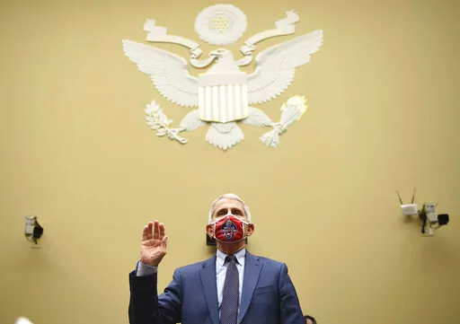 Dr. Anthony Fauci, director of the National Institute for Allergy and Infectious Diseases, is sworn in before a House Subcommittee on the Coronavirus crisis hearing, July 31, 2020 on Capitol Hill in Washington. Fauci steps down from a five-decade career in public service at the end of the month, one shaped by the HIV pandemic early on and the COVID-19 pandemic at the end. (Kevin Dietsch/Pool via AP, File)