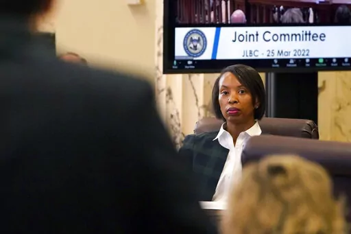 Rep. Angela Cockerham, I-Magnolia, listens as Mississippi's revenue estimate is discussed during a meeting of the Joint Legislative Budget Committee, Friday, March 25, 2022, at the Capitol in Jackson, Miss. (AP Photo/Rogelio V. Solis)