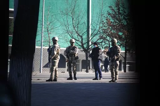Police block the road to control the traffic in Almaty, Kazakhstan, Wednesday, Jan. 12, 2022. Kazakh authorities said Wednesday they detained 1,678 more people in the past 24 hours over their alleged participation in the violent unrest that rocked the former Soviet nation last week, the worst since Kazakhstan gained independence three decades ago. (AP Photo)