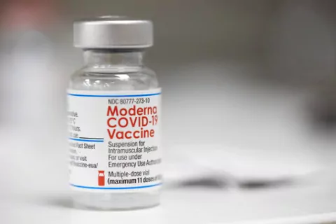 A vial of the Moderna COVID-19 vaccine is displayed on a counter at a pharmacy in Portland, Ore., Monday, Dec. 27, 2021. U.S. regulators have granted full approval to Moderna’s COVID-19 vaccine after reviewing additional data on its safety and effectiveness. The decision Monday, Jan. 31, 2022 by the Food and Drug Administration comes after many tens of millions of Americans have already received the shot under its original emergency authorization. Full approval means FDA has completed the same