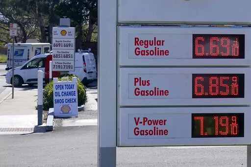 The gasoline price board is shown at a gas station in Menlo Park, Calif., March 21, 2022. A majority of Americans say they don't blame President Joe Biden for high gasoline prices, but they're giving his economic leadership low marks amid fears of inflation and deepening pessimism about economic conditions.(AP Photo/Jeff Chiu)