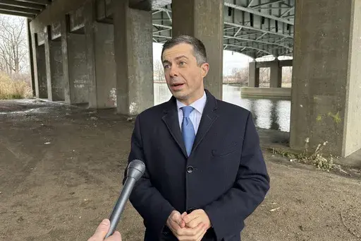 Transportation Secretary Pete Buttigieg speaks to an Associated Press reporter during an interview Monday, Dec. 9, 2024, in Monroe, Mich. (AP Photo/Mike Householder)